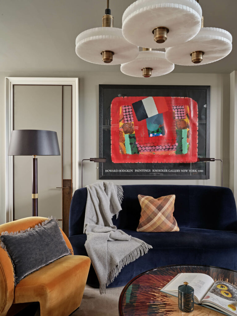 the den of a London home with abstract artwork on the walls