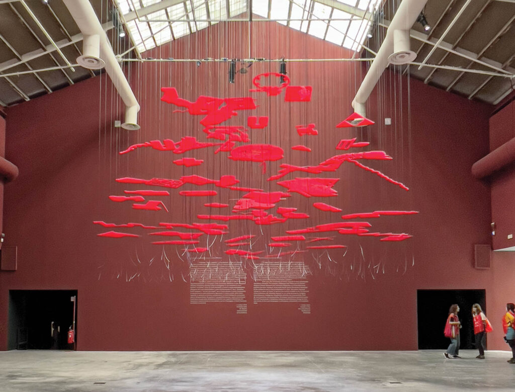 Loom, the red hanging installation at the entrance to the 2023 Venice Biennale