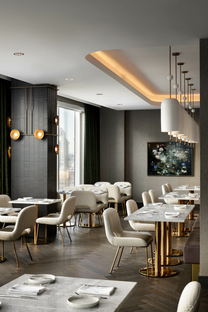 white seating against a moody background in a hotel restaurant 