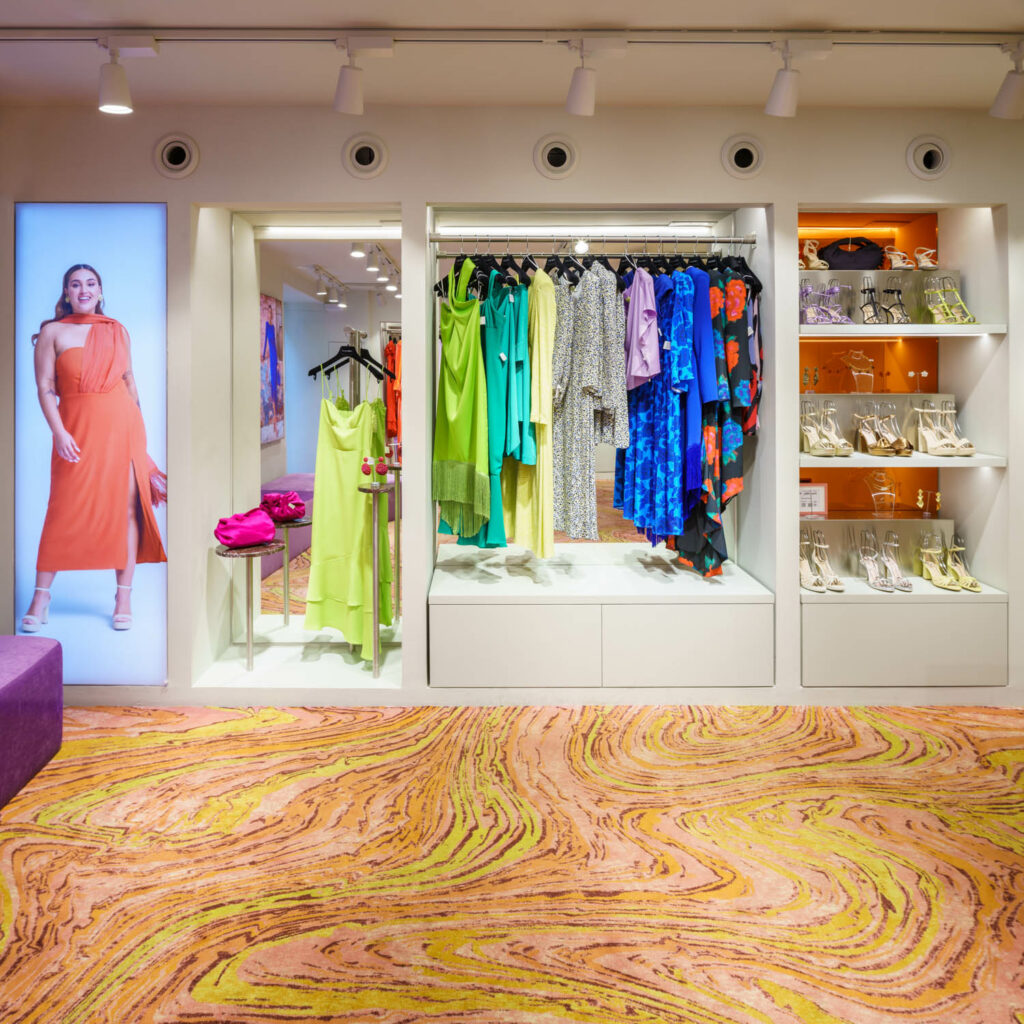recessed displays hold brightly colored clothing and accessories at Lady Pipa