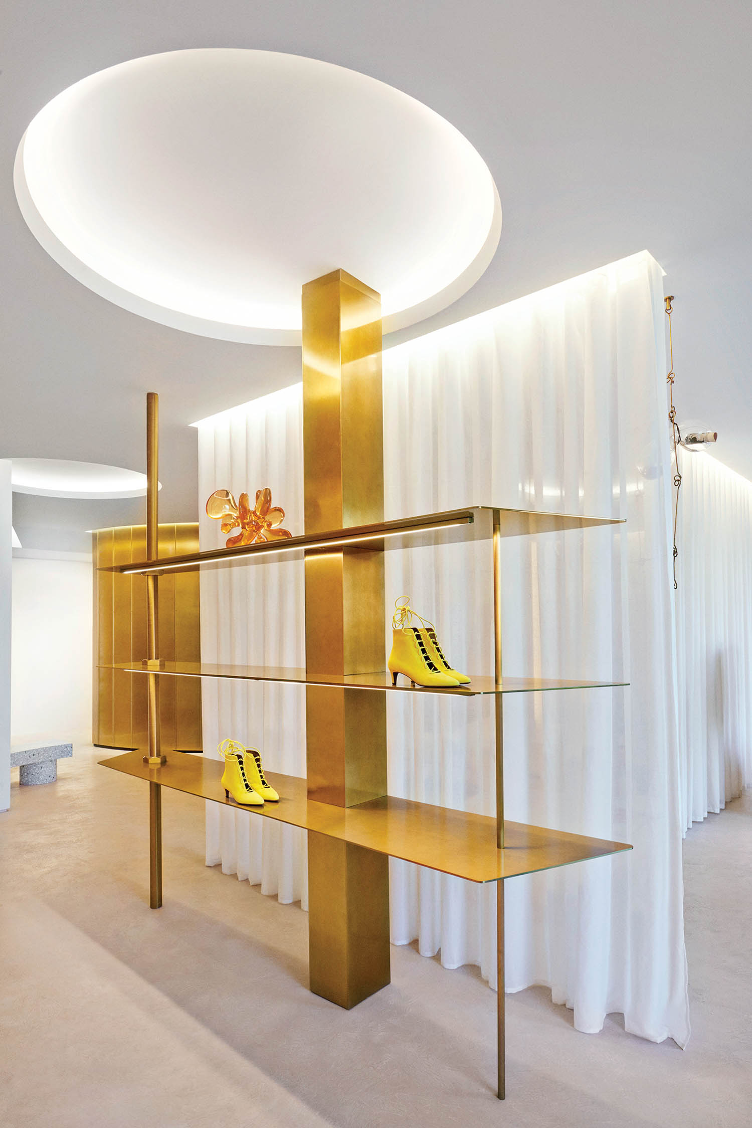 gold shelves display women's shoes
