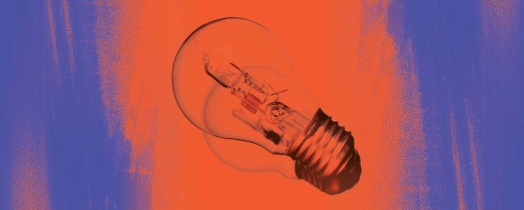 a lightbulb tilted to the left on an orange and purple background