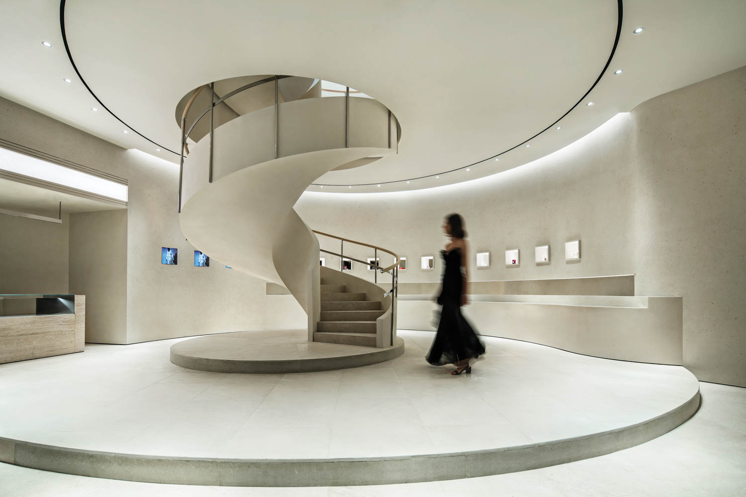 a sculptural spiral staircase in a women's luxury clothing store