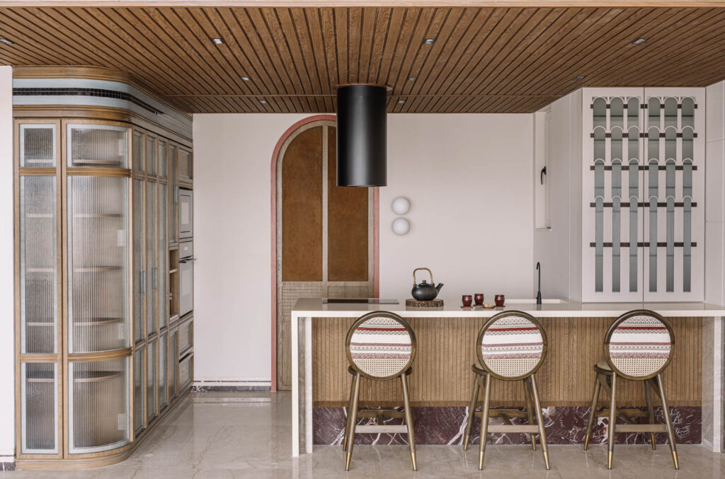 a neutral-toned, modern penthouse kitchen