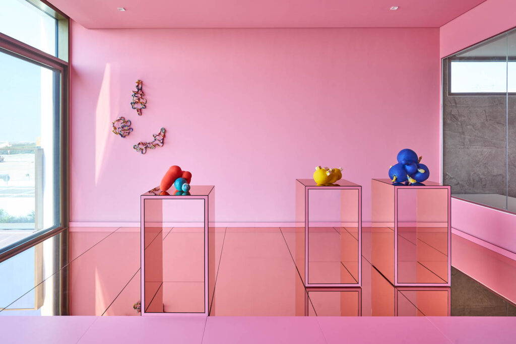 A bright pink gallery wall