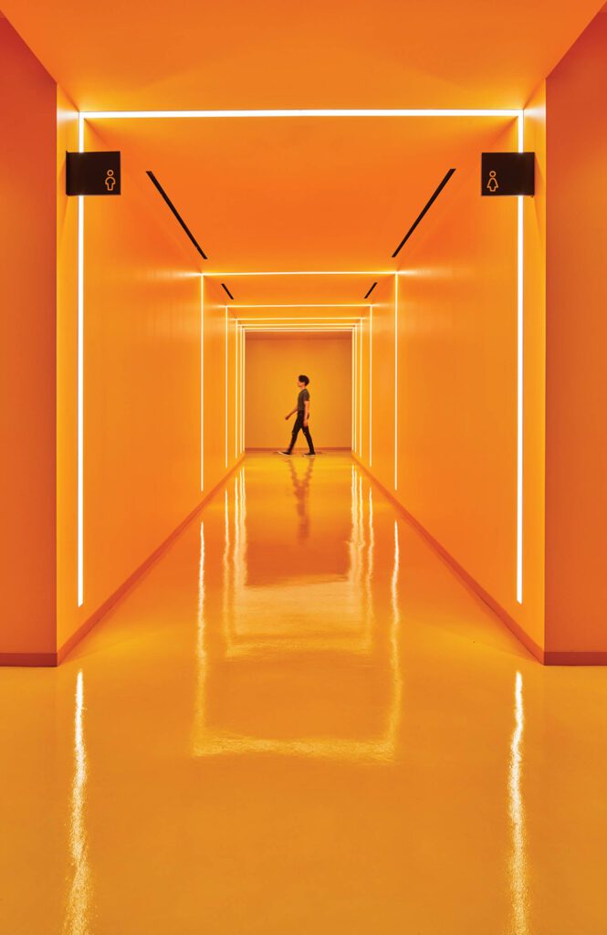 A corridor’s taxi-hued epoxy flooring and paint. 