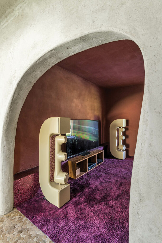 an organically shaped entrance to the music room of this home