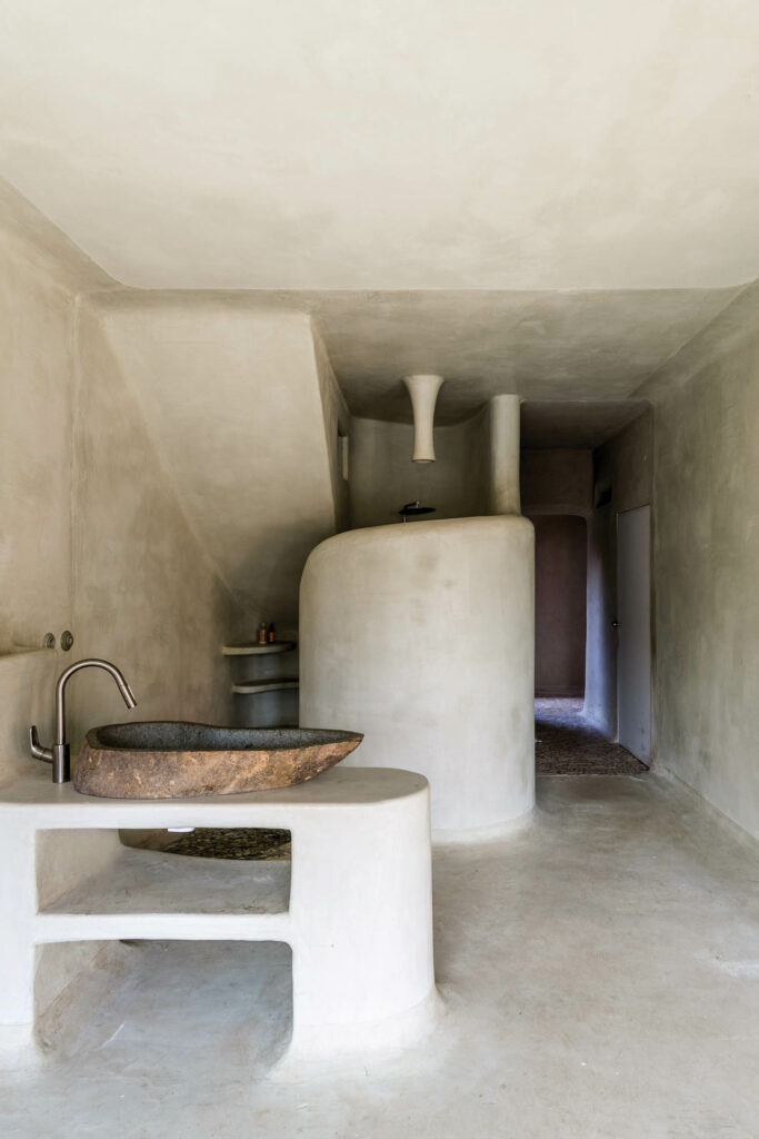 a stoney, minimalist bathroom