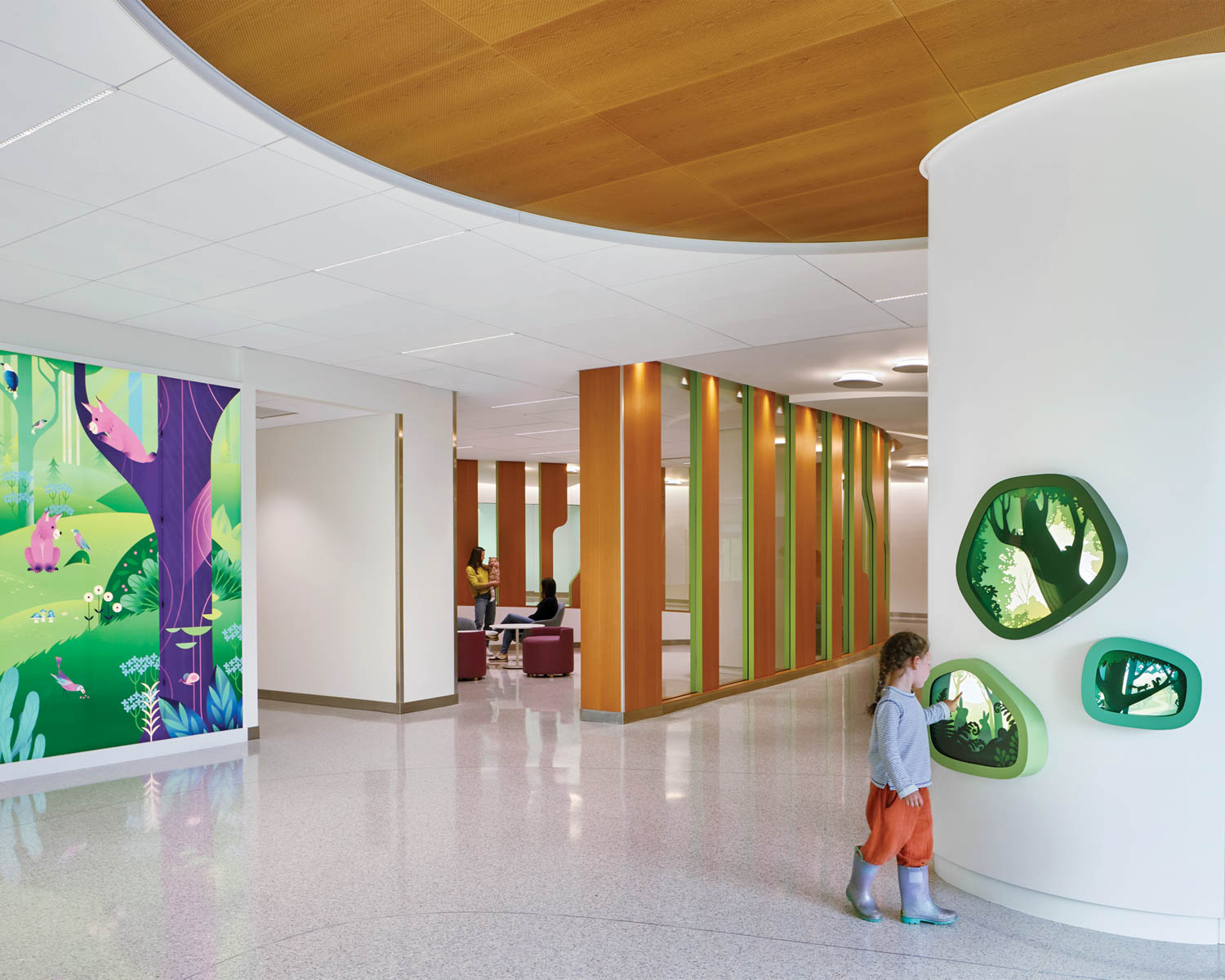 Children follow storybook wayfinding images in Building Care, Seattle Children’s.