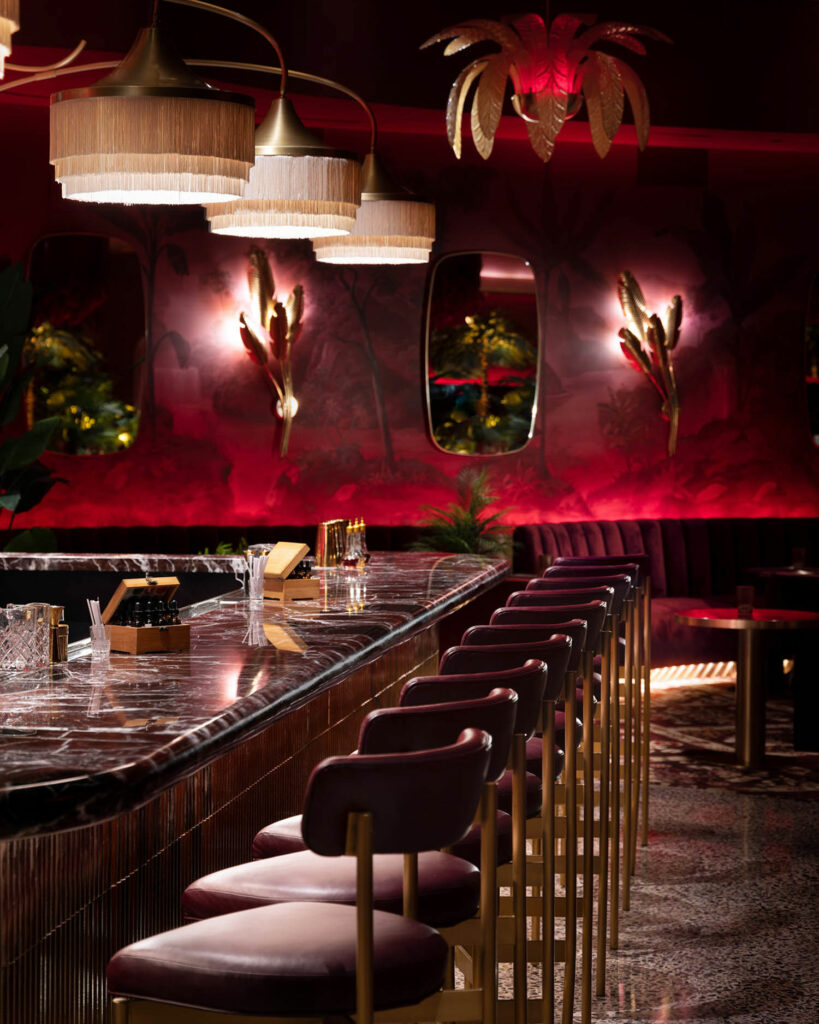 The bar is illuminated with dim red lighting